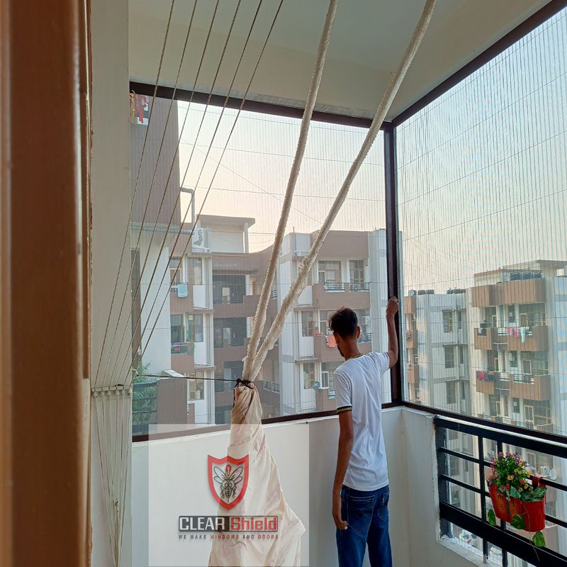 a man standing in a room with a window