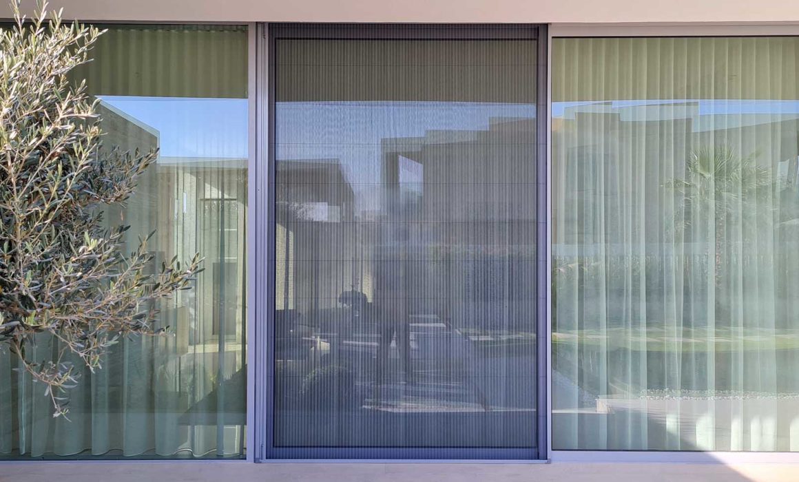 a glass door with a window screen