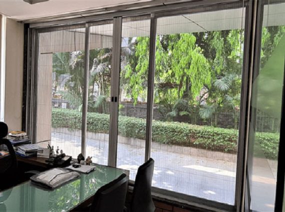 a desk with a glass door