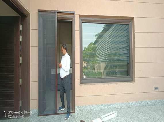 Mosquito Net For Door a man standing in a doorway