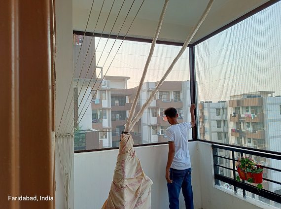 Durable Mosquito Net for Balcony – Insect Protection with Fresh Air Ventilation A close-up image of a mosquito net securely fitted across a balcony entrance, providing protection against insects while allowing fresh air to circulate.
